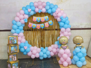 Baby Shower Ring Balloon Decoration with Pink & Blue Theme, Baby Cutouts & Gold Fringe Backdrop